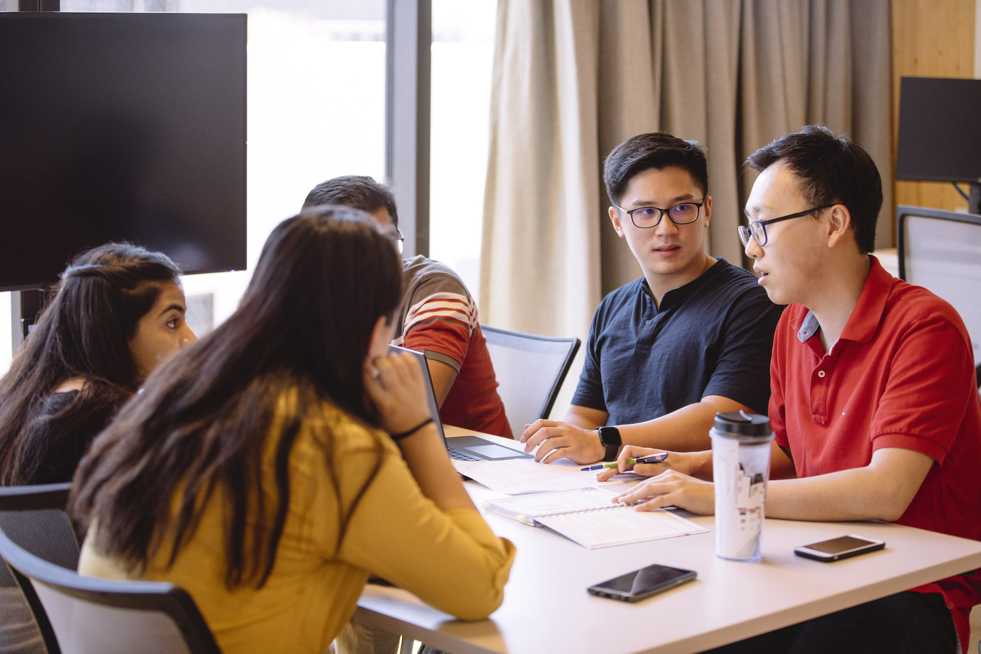 A group of students sitting at a table